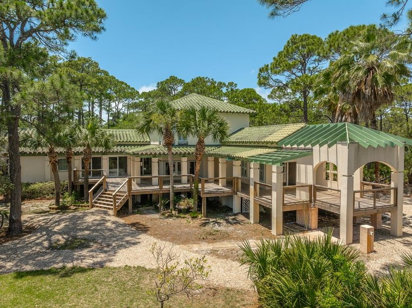 Tucked among mature palms and native vegetation inside St - Beach Home for sale in St. George Island, Florida on Beachhouse.com