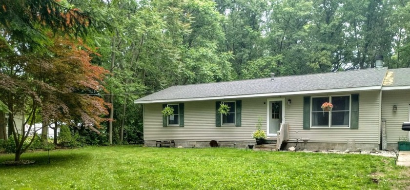 Lovely ranch home on an acre lot and surronded on all sides with - Beach Home for sale in Muskegon, Michigan on Beachhouse.com