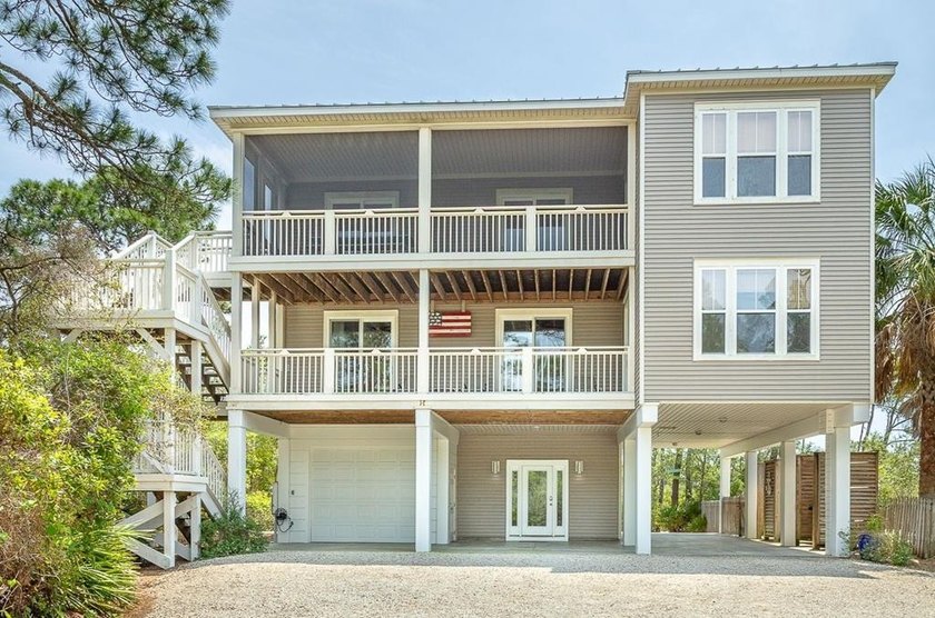 A winding driveway leads through lush native vegetation to - Beach Home for sale in St. George Island, Florida on Beachhouse.com