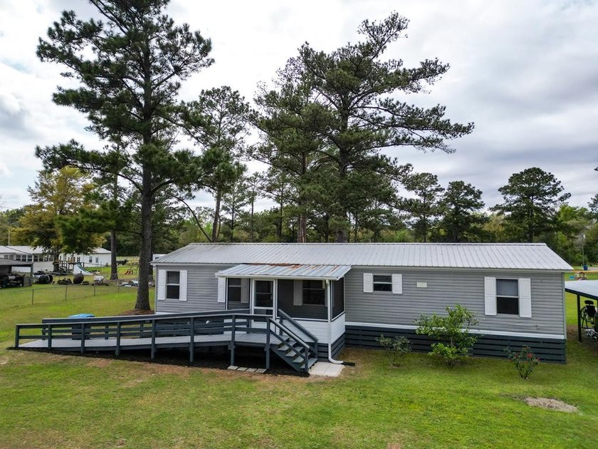 Charming country retreat on a spacious one-acre cleared and - Beach Home for sale in Wewahitchka, Florida on Beachhouse.com
