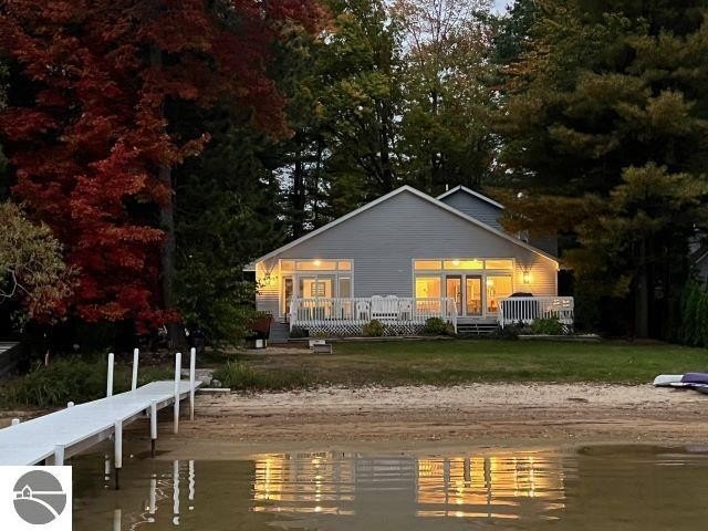 Waterfront dreams await! This charming contemporary home boasts - Beach Home for sale in Traverse City, Michigan on Beachhouse.com