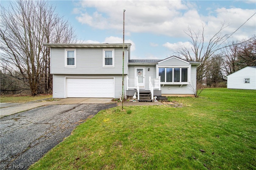 Welcome to 5301 Clay Street! This split level home is located in - Beach Home for sale in Geneva, Ohio on Beachhouse.com