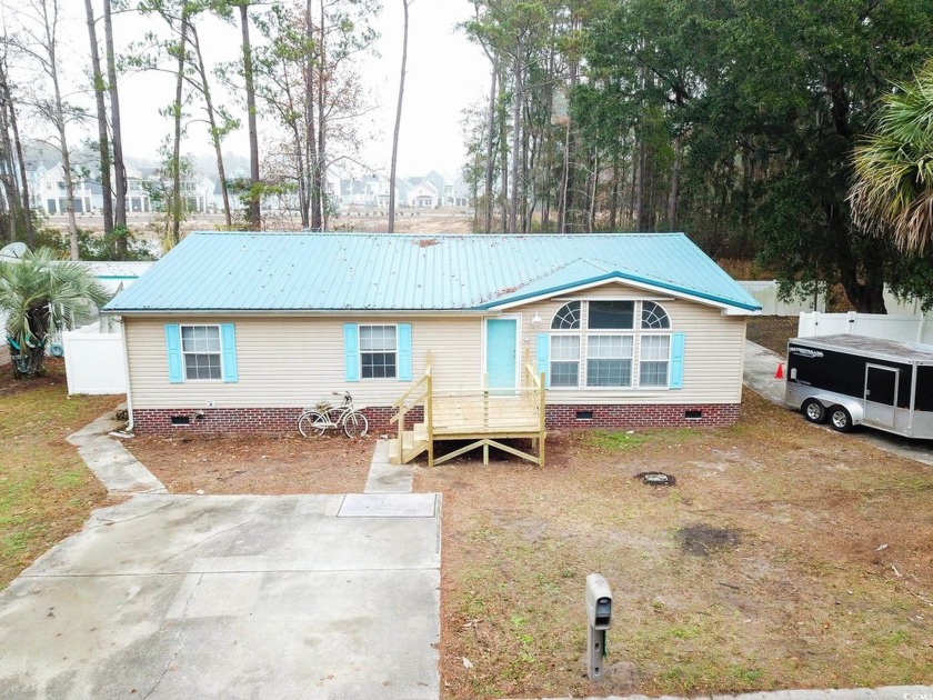 Welcome to 320 Misty Breeze Ln, a charming 3-bedroom, 2-bathroom - Beach Home for sale in Murrells Inlet, South Carolina on Beachhouse.com