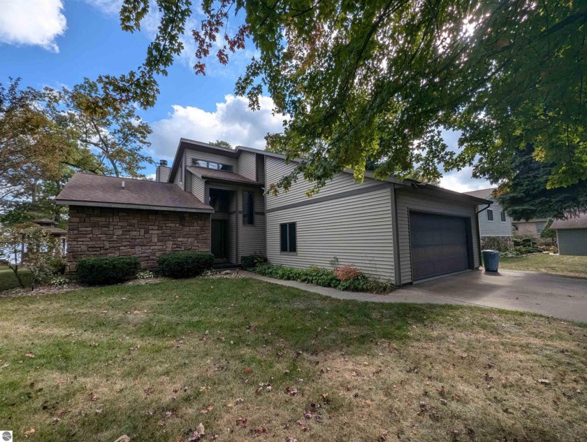 Enjoy 80' of sandy beach frontage along Lake Huron with this - Beach Home for sale in Au Gres, Michigan on Beachhouse.com