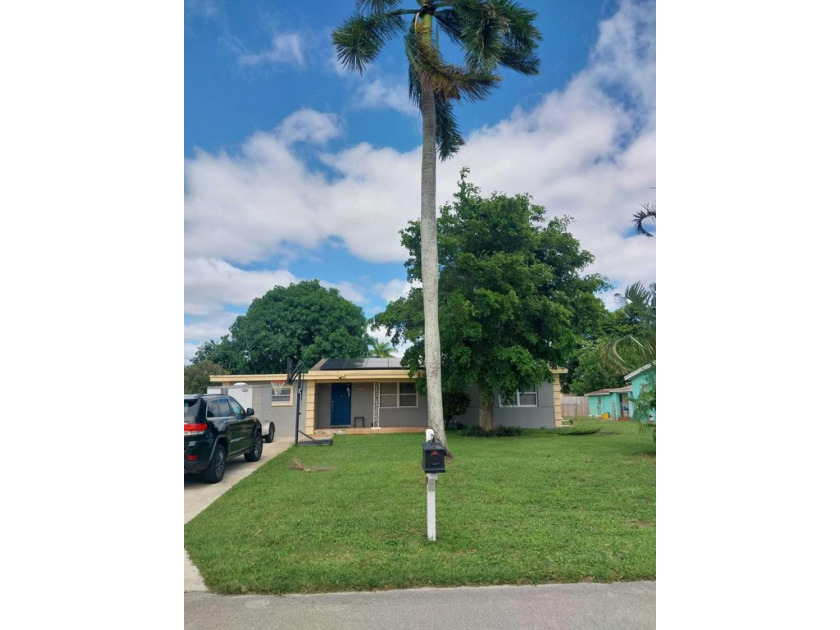 Charming 2-Bedroom, 1-Bath Home with a 1/1 Studio in the Heart - Beach Home for sale in Palm Springs, Florida on Beachhouse.com