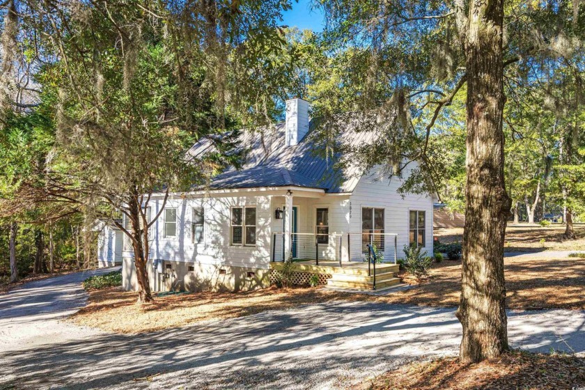 This Superior Country Cottage is nestled in a Beautifully Wooded - Beach Home for sale in Pawleys Island, South Carolina on Beachhouse.com