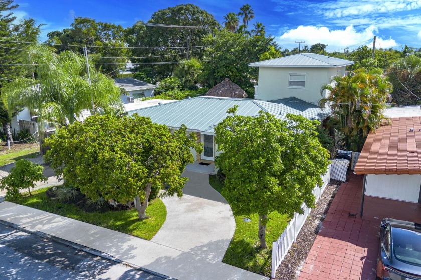 This 4-bedroom, 3-bath pool home is made for Florida living! The - Beach Home for sale in Lake Worth Beach, Florida on Beachhouse.com