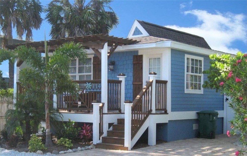 Elevated, charming, and just five houses from the beach, this - Beach Home for sale in Holmes Beach, Florida on Beachhouse.com