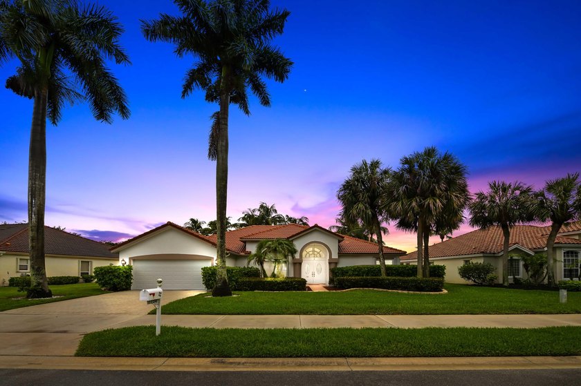 Welcome to this beautifully maintained pool & lakefront home - Beach Home for sale in Lake Worth, Florida on Beachhouse.com
