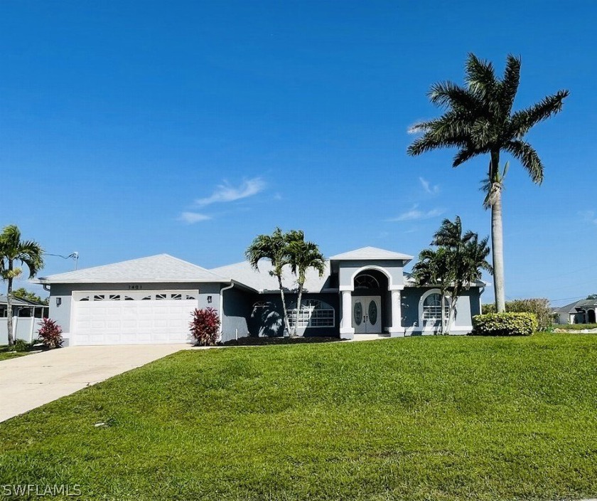 Welcome to this exquisite property nestled on an oversized - Beach Home for sale in Cape Coral, Florida on Beachhouse.com