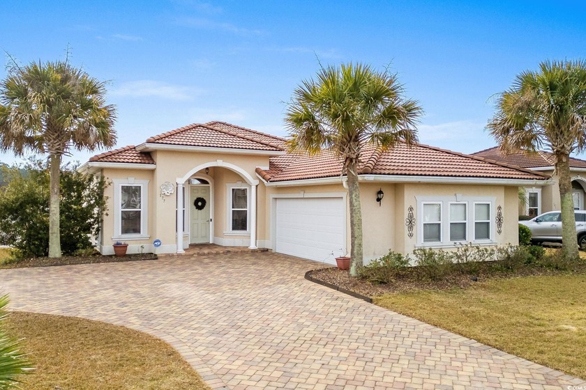 Welcome to this charming Mediterranean-style home located in the - Beach Home for sale in Little River, South Carolina on Beachhouse.com