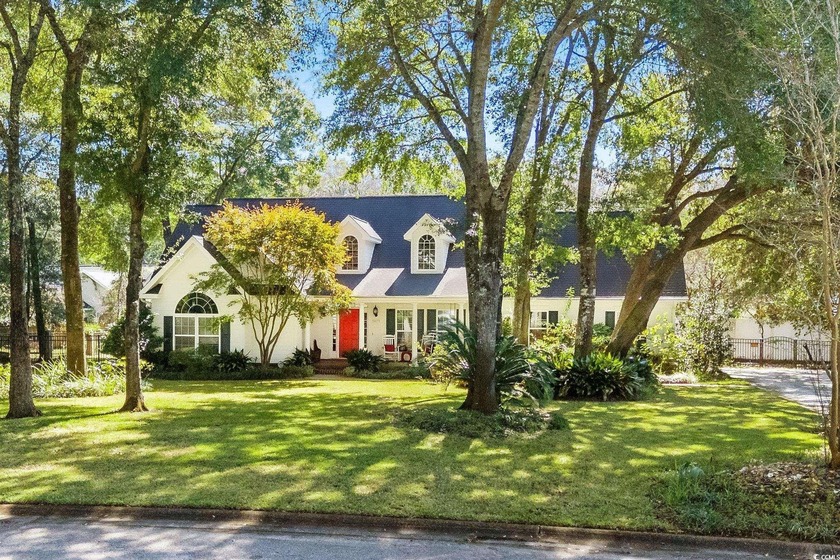 Your Hidden Gem Awaits! Surrounded by towering live oaks, this - Beach Home for sale in Murrells Inlet, South Carolina on Beachhouse.com