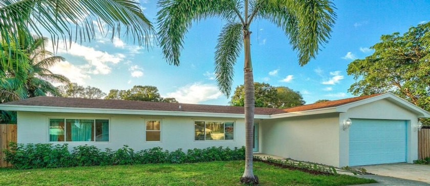 Nestled in the heart of Lake Clarke Shores, this beautifully - Beach Home for sale in Lake Clarke Shores, Florida on Beachhouse.com