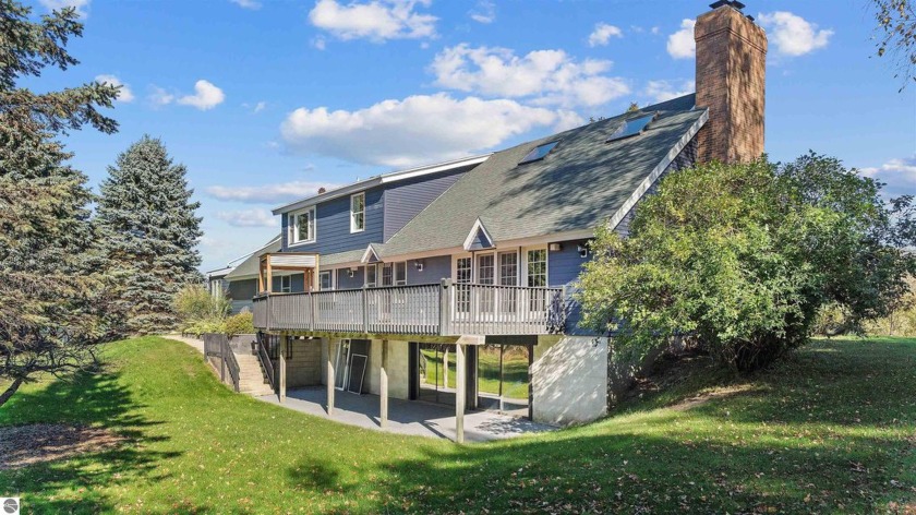 Welcome to Northern Michigan! This expansive home sits on 10 - Beach Home for sale in Ellsworth, Michigan on Beachhouse.com