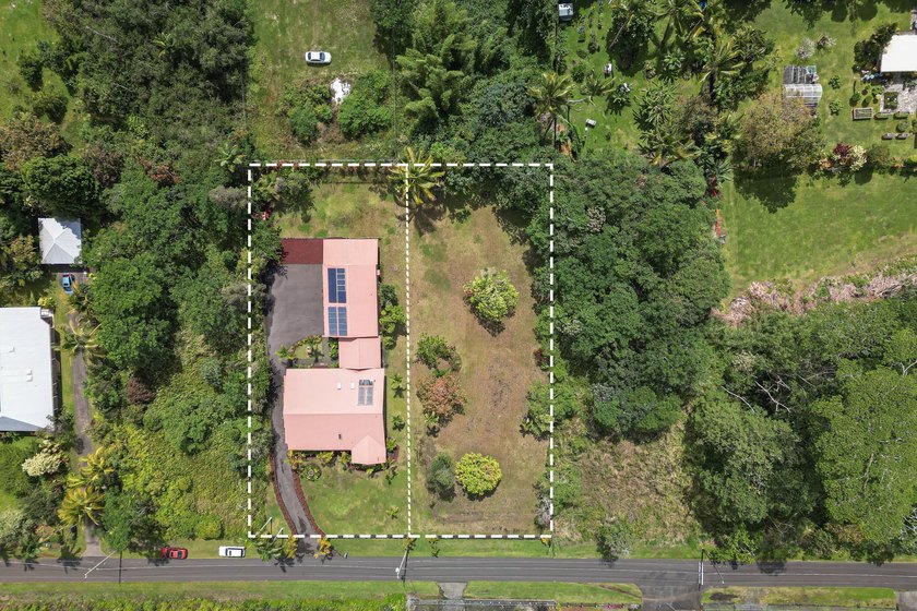 This 1/2 acre lot is to be sold with the home next door, MLS - Beach Lot for sale in Pahoa, Hawaii on Beachhouse.com