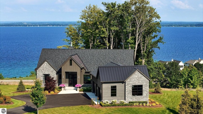 Custom-built gem in Peninsula Shores, crafted in 2023, offers - Beach Home for sale in Traverse City, Michigan on Beachhouse.com