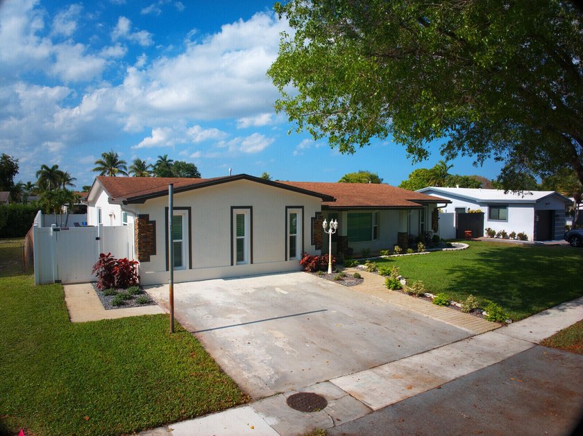 This beautifully maintained 4/2 pool home offers just under 2 - Beach Home for sale in Pembroke Pines, Florida on Beachhouse.com