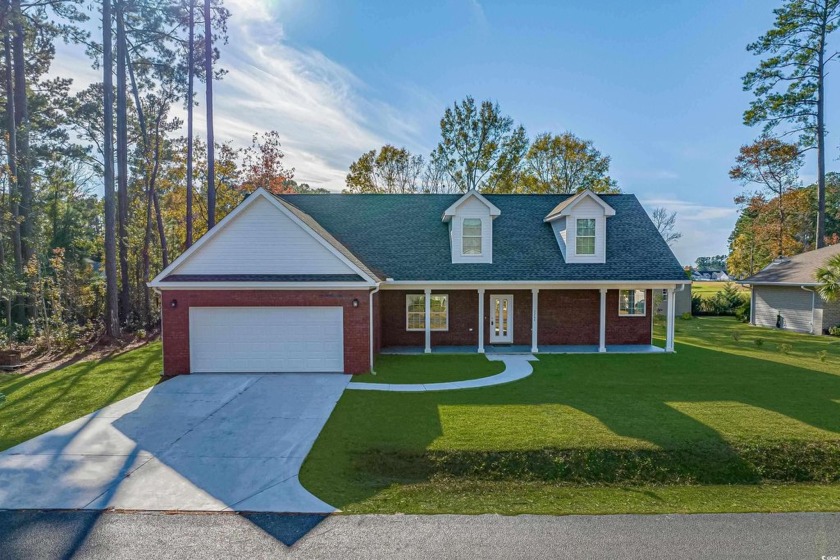 This brand-new, all-brick home in the desirable Long Bay Golf - Beach Home for sale in Longs, South Carolina on Beachhouse.com