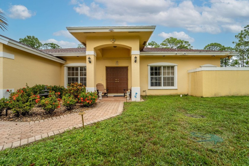 This 4 bedroom, 2 bath home sits on nearly 1.5 acres and is - Beach Home for sale in West Palm Beach, Florida on Beachhouse.com