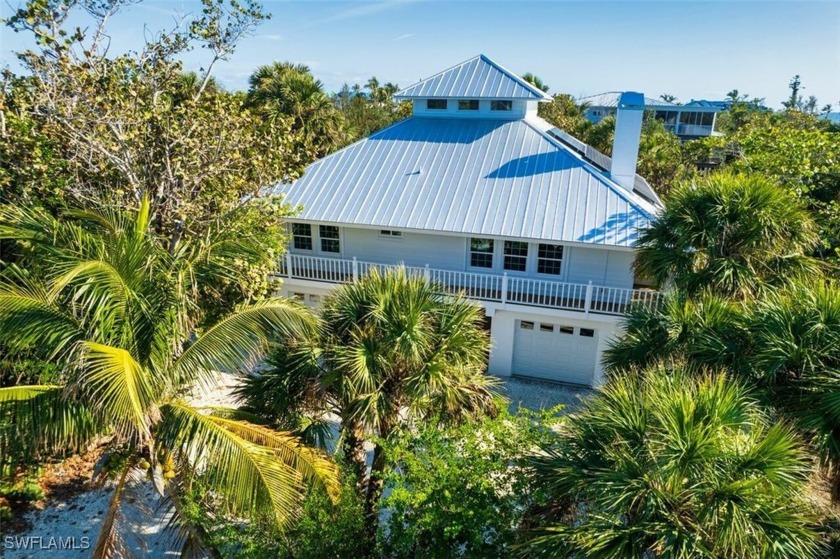 This elevated, Key West style home has a main living level with - Beach Home for sale in Sanibel, Florida on Beachhouse.com