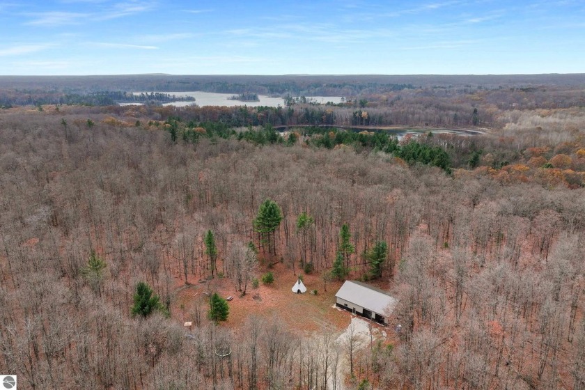 Nestled on 15 acres of serene hardwood forest, this property - Beach Acreage for sale in Empire, Michigan on Beachhouse.com