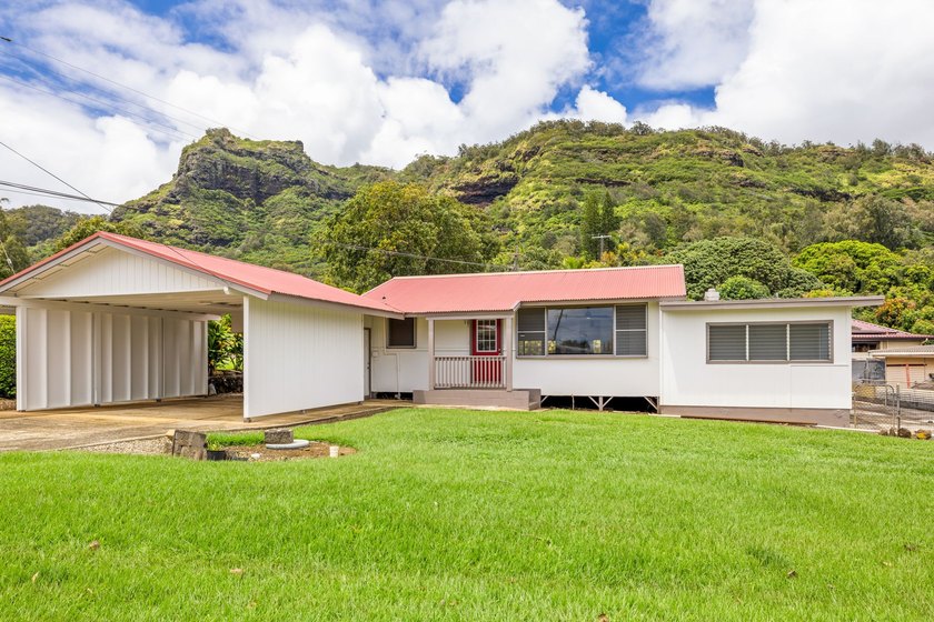 Tucked away in the desirable Wailua Houselots and nestled - Beach Home for sale in Kapaa, Hawaii on Beachhouse.com