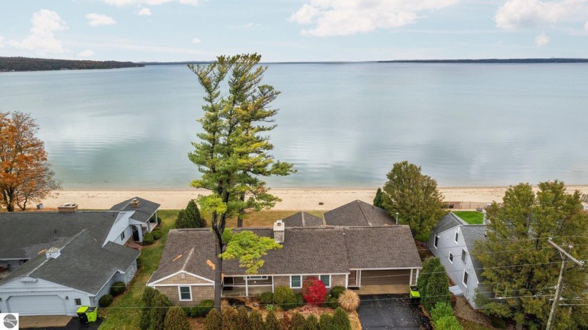 Welcome to easy living on the shores of East Bay! This - Beach Home for sale in Traverse City, Michigan on Beachhouse.com