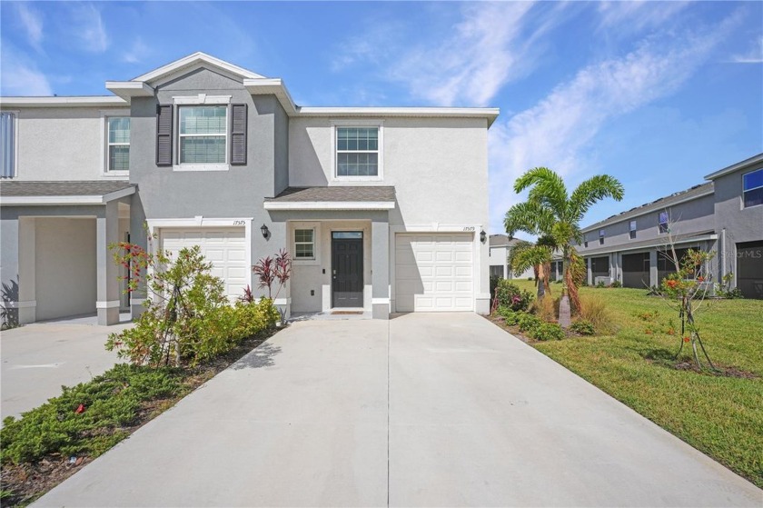 Welcome to 17579 Crescent Moon Loop, a modern sanctuary nestled - Beach Townhome/Townhouse for sale in Bradenton, Florida on Beachhouse.com