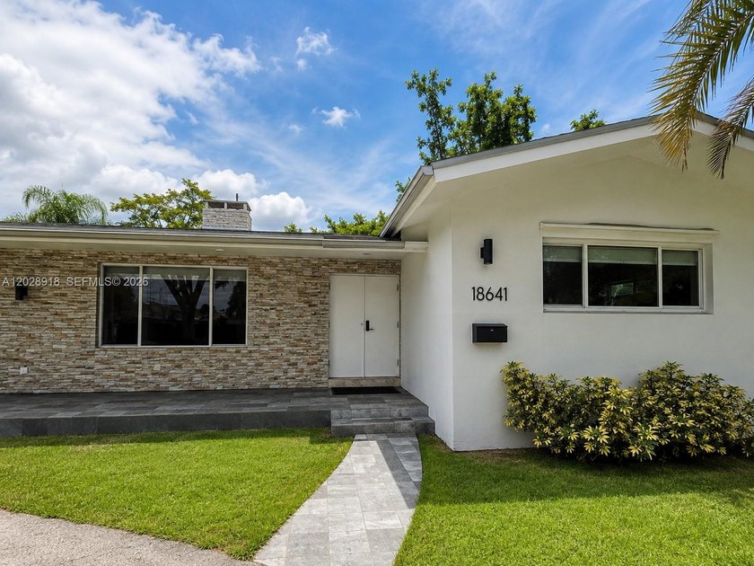 Welcome to 18641 NE 21st Avenue, a beautifully updated residence - Beach Home for sale in Miami, Florida on Beachhouse.com