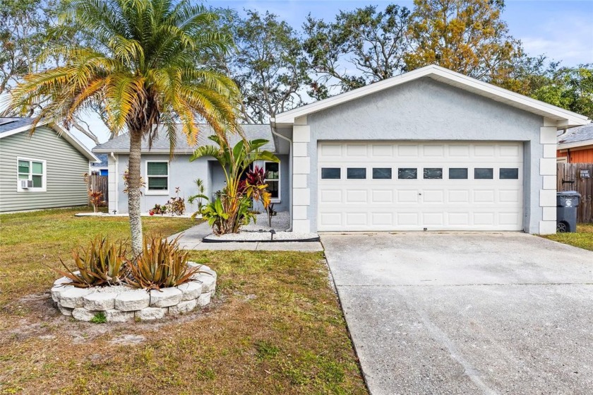 Welcome to this amazing 3-bedroom, 2-bathroom home with a 2-car - Beach Home for sale in Oldsmar, Florida on Beachhouse.com