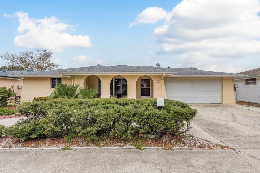 Welcome to this charming three-bedroom, two-bathroom pool home - Beach Home for sale in Port Richey, Florida on Beachhouse.com