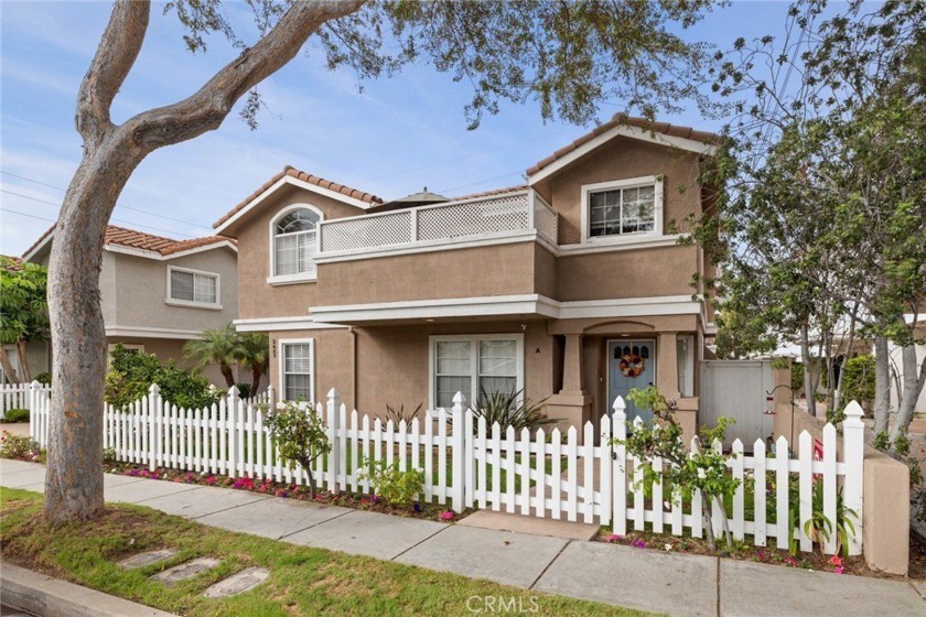 An enclosed front yard with a white picket fence, colorful roses - Beach Townhome/Townhouse for sale in Redondo Beach, California on Beachhouse.com