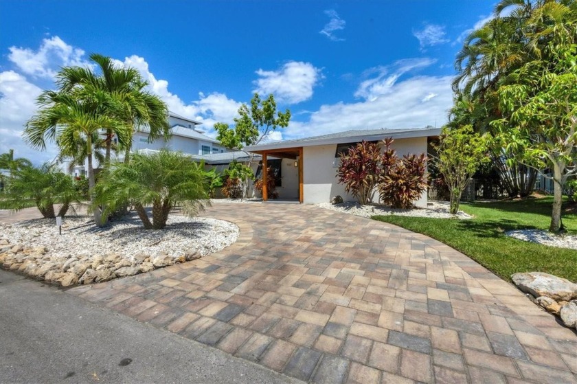 Opportunity knocks! This canal-front home has suffered hurricane - Beach Home for sale in Longboat Key, Florida on Beachhouse.com