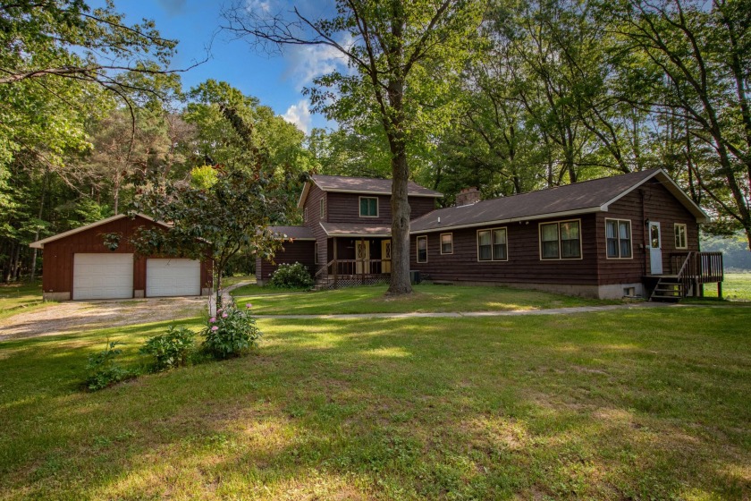 Set on 7.1 acres along the Pentwater River watershed, this - Beach Home for sale in Pentwater, Michigan on Beachhouse.com