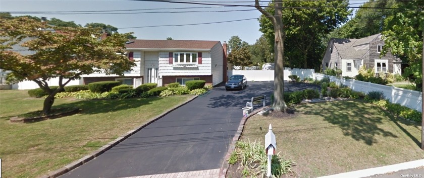 This Hi-Ranch 3 bedroom, 2 bath, family home is centrally - Beach Home for sale in West Babylon, New York on Beachhouse.com