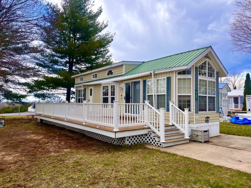 This thriving community is great for year-round living or a - Beach Home for sale in Alanson, Michigan on Beachhouse.com