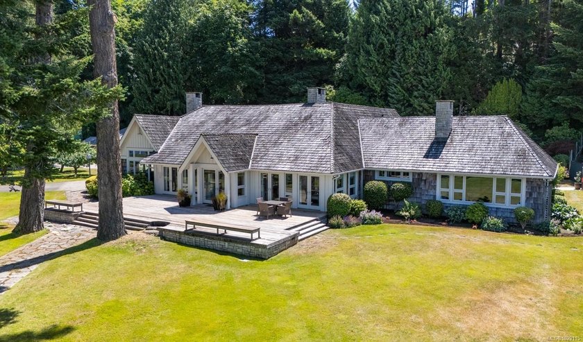 Nestled on the pristine sandy shores of renowned Judges Row in - Beach Home for sale in Qualicum Beach, British Columbia on Beachhouse.com