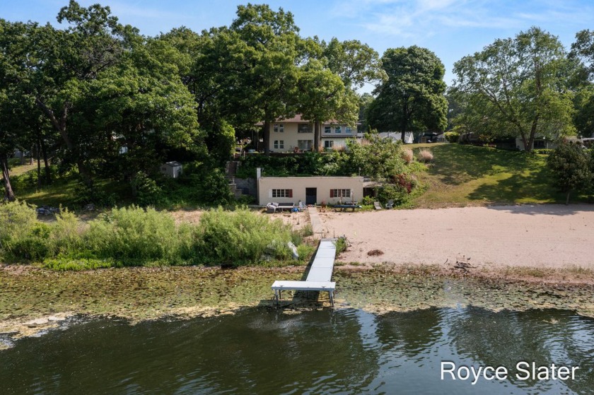 Lakefront Paradise 4 Bed, 3 Bath home is on all-sports Wolf Lake - Beach Home for sale in Muskegon, Michigan on Beachhouse.com