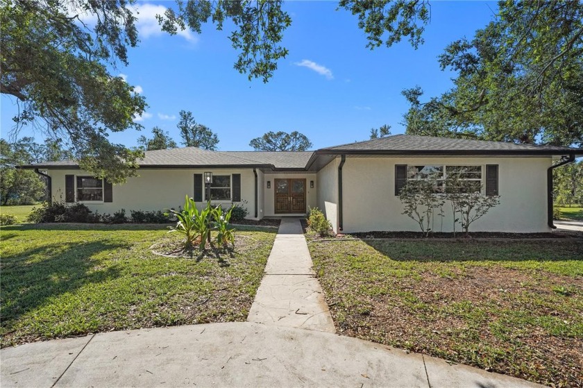 Step into this beautifully renovated pool home in desirable - Beach Home for sale in Nokomis, Florida on Beachhouse.com