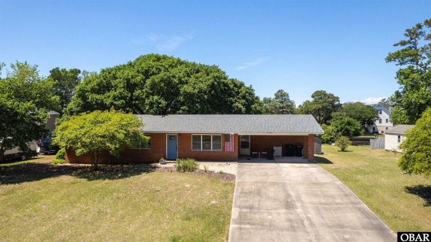 Nestled along the serene canal front in Kitty Hawk, this - Beach Home for sale in Kitty Hawk, North Carolina on Beachhouse.com