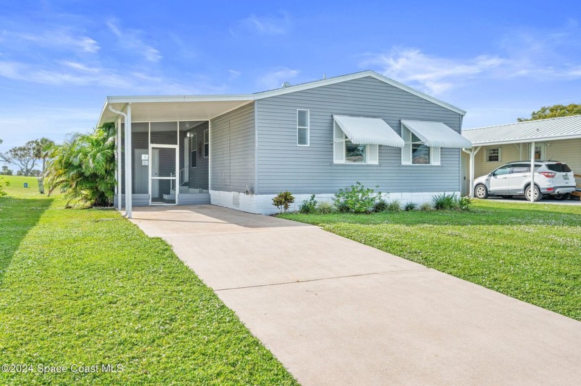 Remodeled in 2023 with a great Golf Course view! Roof, AC and - Beach Home for sale in Barefoot Bay, Florida on Beachhouse.com