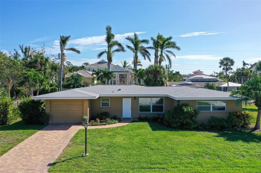 Ideally tucked away in a quiet, private neighborhood on the - Beach Home for sale in Sarasota, Florida on Beachhouse.com