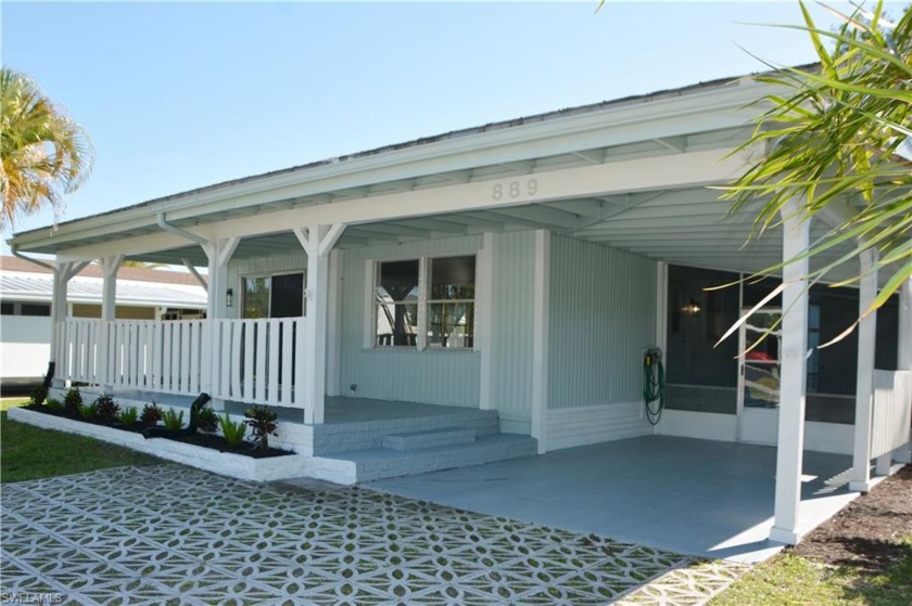 Experience the epitome of lakeside living in this charming - Beach Home for sale in Naples, Florida on Beachhouse.com