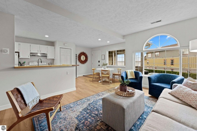 This charming coastal condo boasts West Bay water views from - Beach Condo for sale in Traverse City, Michigan on Beachhouse.com