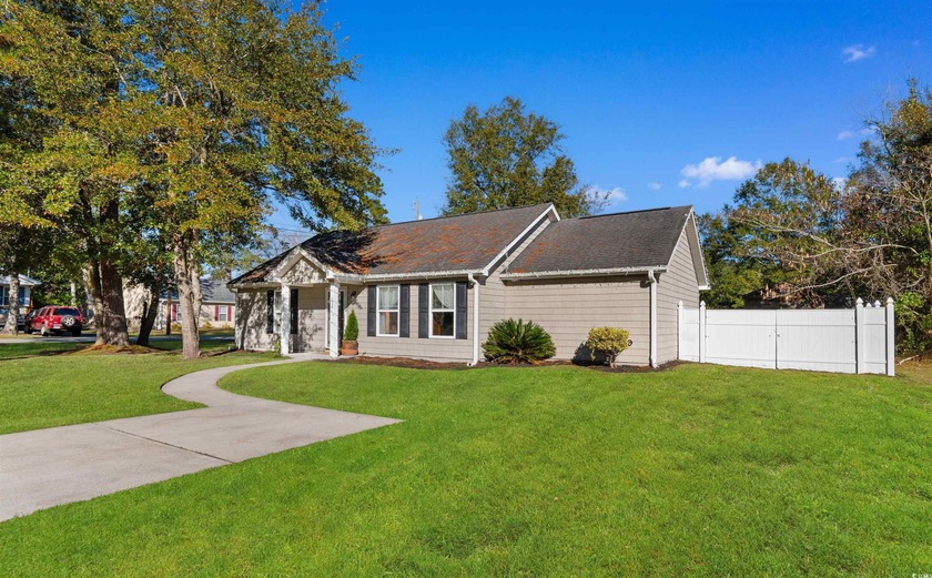 If you could look up *CUTE AS A BUTTON* a picture of this home - Beach Home for sale in Georgetown, South Carolina on Beachhouse.com
