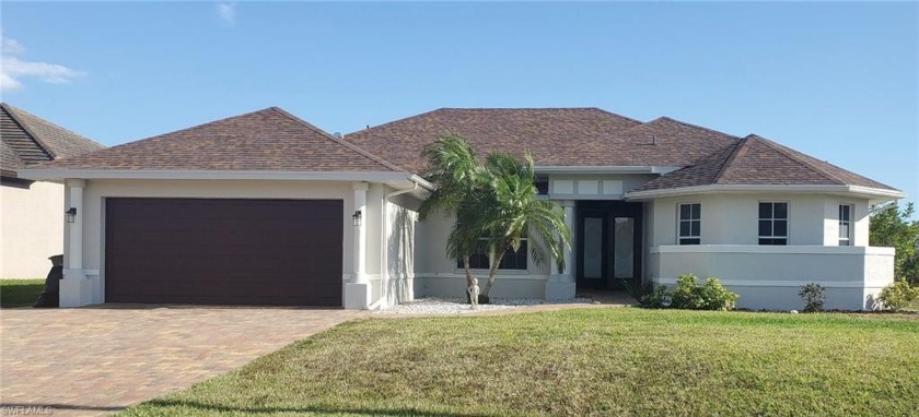This beautiful home is situated on the wide spreader canal that - Beach Home for sale in Cape Coral, Florida on Beachhouse.com