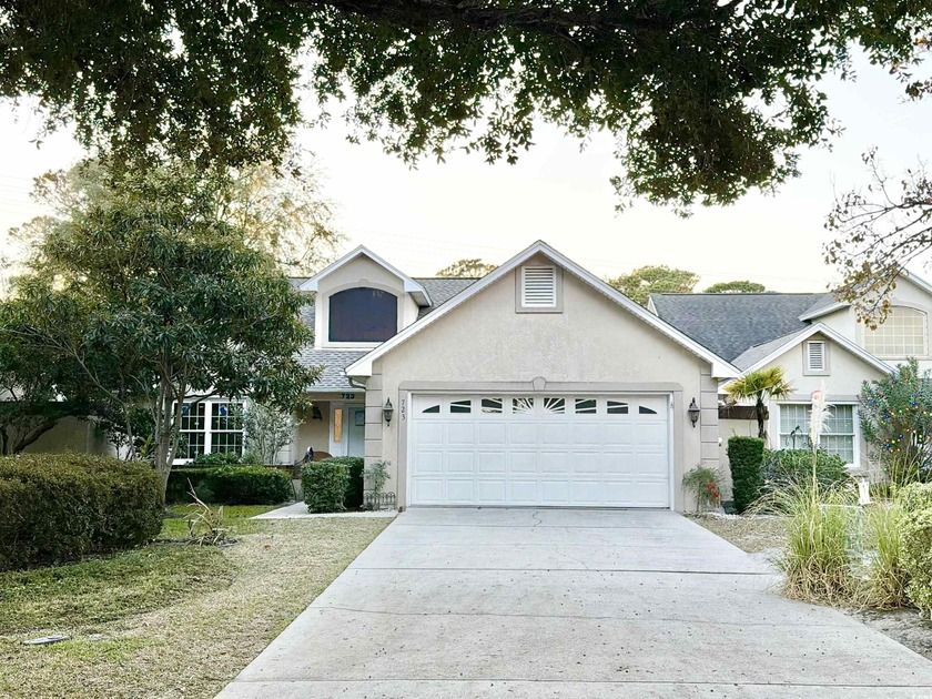 This stunning 3-bedroom, 2-bath single-level home is nestled in - Beach Home for sale in Myrtle Beach, South Carolina on Beachhouse.com