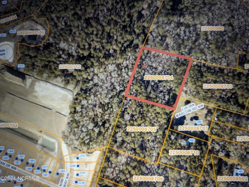 This lot backs up to a new residential subdivision off of - Beach Lot for sale in Calabash, North Carolina on Beachhouse.com