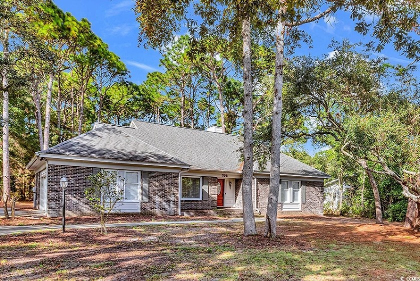 Beautifully updated and all on one level, this charming, brick - Beach Home for sale in Pawleys Island, South Carolina on Beachhouse.com