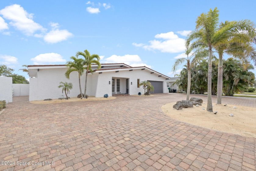 Canal front beauty! Discover why so many want waterfront living - Beach Home for sale in Cocoa Beach, Florida on Beachhouse.com